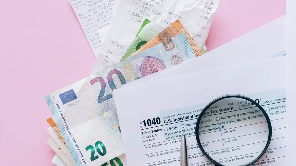 Tax forms, receipts and euro banknotes